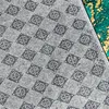 Close-up view of the underside of a rug, showing its textured pattern and a small section of the top side with a green and yellow design. Náhled obrázku produktu