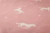 A close-up view of a pink blanket with a repeating pattern of white horses and small crosses. Náhľad obrázku produktu