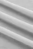 A close-up view of a folded gray fabric, likely a blanket or sheet, showing its texture and folds. Podgląd zdjęcia produktu
