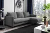 A modern living room with a grey sectional sofa, a large window with a forest view, and a white coffee table. Produktbild-Vorschau