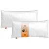 Two white pillows are shown on a white background. One pillow is in front of the other, slightly to the right. A label is attached to the front pillow. Náhled obrázku produktu