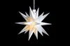 A white star-shaped lamp with 18 points hangs against a black background. Produktbild-Vorschau