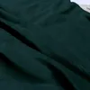 A close-up view of dark green plush fabric, showing its texture and folds. Produktbild-Vorschau