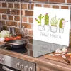 A kitchen counter with a stovetop, a cutting board with vegetables, and a glass splashback with a cactus illustration. Voir les images du produit