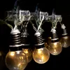 A close-up shot of a string of decorative lights with bulb-shaped covers, attached to a surface with suction cups. Produktbild-Vorschau
