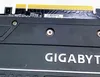 Close-up of a Gigabyte graphics card, showing the connector pins and part of the casing with the brand name. Podgląd zdjęcia produktu