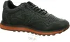 A single green sneaker with an orange sole is shown against a white background. Voir les images du produit