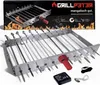 A product shot of a stainless steel rotisserie attachment with skewers and a motor, displayed on a white background with a product box in the background. Produktbild-Vorschau