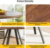 A collage of four images showcasing the details of a round dining table, including its material, surface pattern, and legs. Produktbild-Vorschau
