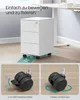A white rolling cabinet with three drawers is shown on a wooden floor, with a desk in the background. The bottom part of the image shows close-ups of the wheels. Produktbild-Vorschau