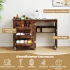 A sewing table with various compartments and sewing supplies is shown in a room setting. Podgląd zdjęcia produktu