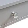 A close-up view of a drawer knob on a light gray drawer. Podgląd zdjęcia produktu