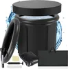 A black inflatable ice bath with a lid, surrounded by water splashes and accessories. Produktbild-Vorschau