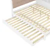 A close-up view of a white bed frame with a pull-out trundle bed, showing the wooden slats. Produktbild-Vorschau