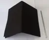 A black charcoal filter with a V-shaped crease and a few silver metal rods lying next to it on a white background. Produktbild-Vorschau