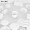 A collection of white ventilation components arranged on a light gray surface. Anteprima dell’immagine prodotto