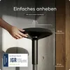 A hand is shown adjusting a black stool, with text overlays indicating features and certifications. Produktbild-Vorschau