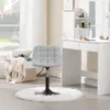 A gray chenille stool with a white fluffy rug in front of a white vanity table. Produktbild-Vorschau