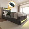 A bedroom scene featuring a bed with integrated lighting and charging features. Voir les images du produit