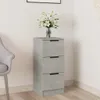 A gray sideboard with three drawers is placed in a room next to a gray chair. A vase of white lilies sits on top of the sideboard. Anteprima dell’immagine prodotto