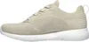 Side view of a beige athletic shoe. Voir les images du produit