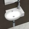 A white ceramic sink with a silver faucet is mounted on a white shelf against a dark brown tiled wall. Anteprima dell’immagine prodotto