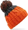 A knitted beanie with a pom-pom on top, shown against a white background. Náhled obrázku produktu