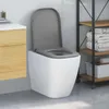 A modern bathroom setting with a wall-mounted toilet and a wooden vanity. Náhľad obrázku produktu