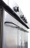 A close-up, angled view of a stainless steel grill or oven with multiple burners and handles. Produktbild-Vorschau