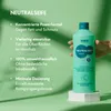 A hand holds a bottle of HAKA Neutralseife Original cleaner against a green background with text describing its features. Produktbild-Vorschau