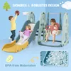 Children playing on a multi-functional playground set with a slide and swing. Anteprima dell’immagine prodotto