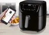 A hand holding a smartphone displaying an air fryer app next to a black air fryer and a bowl of food. Produktbild-Vorschau