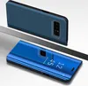 Two blue phone cases are shown, one open and one closed, on a light gray and white surface. Produktbild-Vorschau
