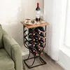 A wine rack with bottles and glasses on top, next to a sofa. Náhľad obrázku produktu