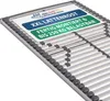 A close-up, angled view of a bed slat base with a label on top. Produktbild-Vorschau