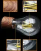 Close-up view of a decorative LED light bulb with a wood-grain base, showing magnified details of the filament and base. Produktbild-Vorschau