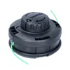 A black string trimmer head with green trimmer line, shown against a white background. Produktbild-Vorschau
