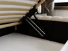 Close-up view of the underside of a bed frame, showing the lifting mechanism and wooden slats. Produktbild-Vorschau