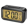 A black digital alarm clock with a gold display. Náhled obrázku produktu