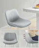 A collection of images showing a modern gray chair, with one image depicting it at a dining table with a slice of cake, and others highlighting its ergonomic design. Náhled obrázku produktu