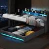 A modern bedroom with a bed that has its storage compartment open, revealing organized items and LED lighting. Produktbild-Vorschau