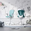 Two teal and white ergonomic chairs are set up in a child's room with a whimsical mural on the wall. Náhled obrázku produktu