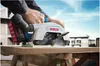 A person using a Bosch circular saw to cut a piece of wood outdoors. Anteprima dell’immagine prodotto