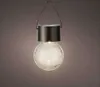 A solar-powered garden lantern shaped like a lightbulb with a cracked glass effect, hanging from a metal handle. Produktbild-Vorschau