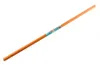 A long, thin, orange cylindrical object, likely a handle or pole, is shown diagonally against a white background. A colorful label with text and graphics is wrapped around the middle of the object. Voir les images du produit