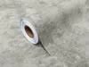 A roll of adhesive vinyl with a concrete texture. Produktbild-Vorschau