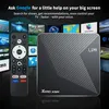 A streaming box and remote control are shown against a background of various TV screens displaying different content. Podgląd zdjęcia produktu