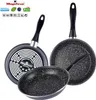 Three black frying pans with speckled gray interiors and black handles are arranged on a white background. The pans are of different sizes and are shown from various angles. Náhľad obrázku produktu