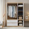 A modern wardrobe with clothes hanging and folded items on shelves. Anteprima dell’immagine prodotto