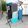 A black foldable drying rack with multiple towels of different colors is displayed in a bathroom setting. Anteprima dell’immagine prodotto
